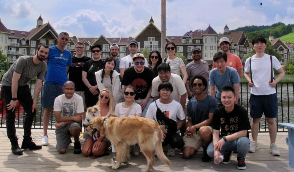 The Finnovate team outside in front of a lake in a ski village